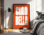 Orange framed poster with 'CIAO BELLA' in a bedroom setting