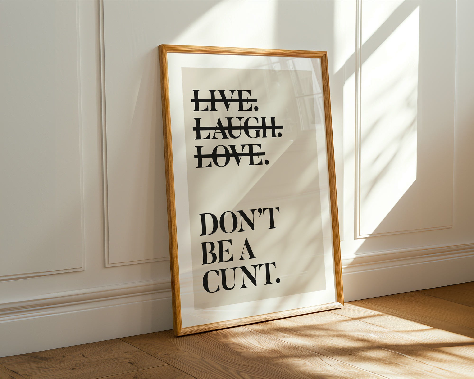 Framed poster with motivational quote on a wall