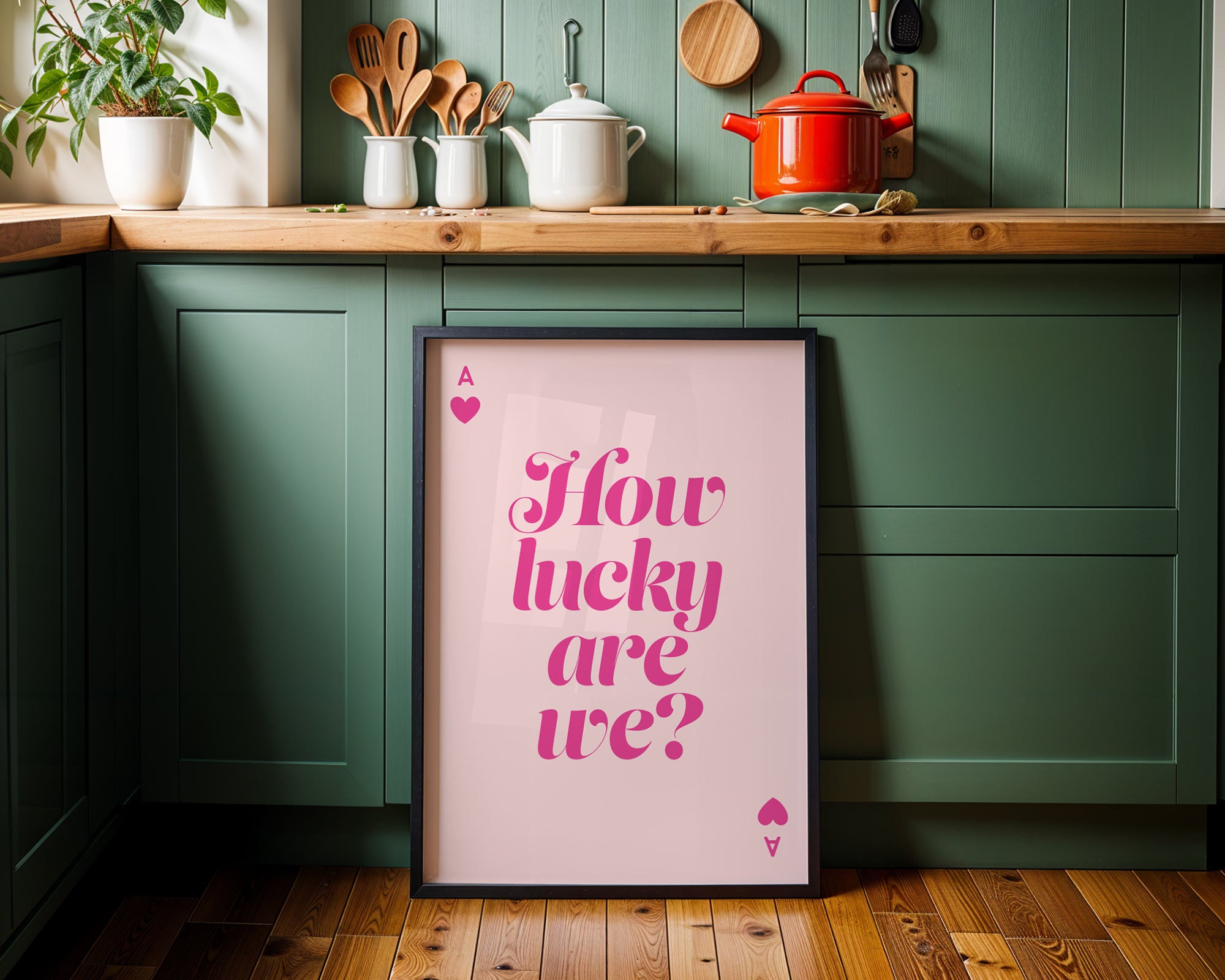 Framed poster with 'How lucky are we?' text in a kitchen setting