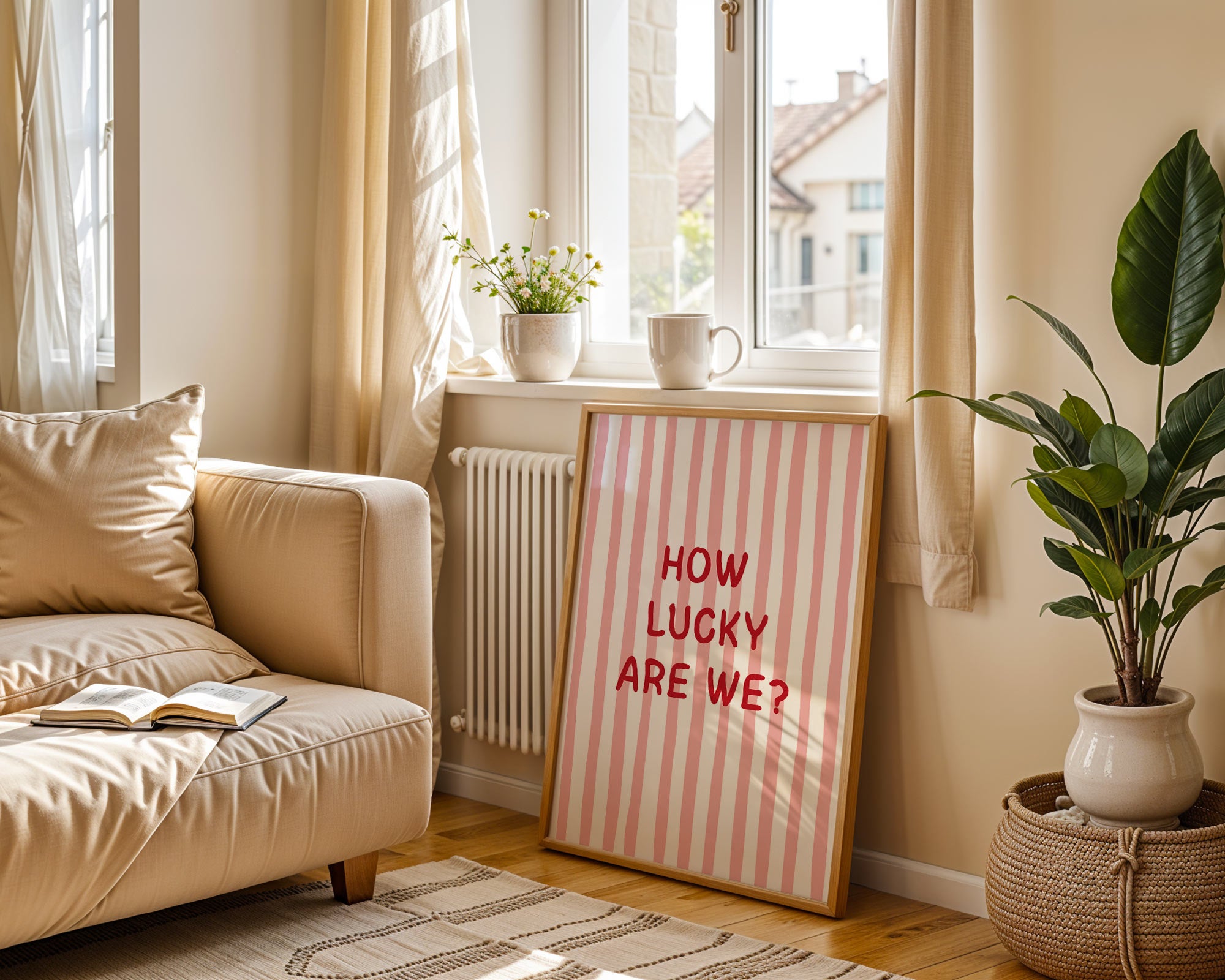 Living room with a beige sofa, plant, and a sign reading 'How Lucky Are We?'.