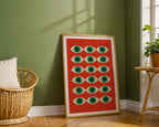 Framed artwork with geometric pattern in a room with green walls and wooden floor.