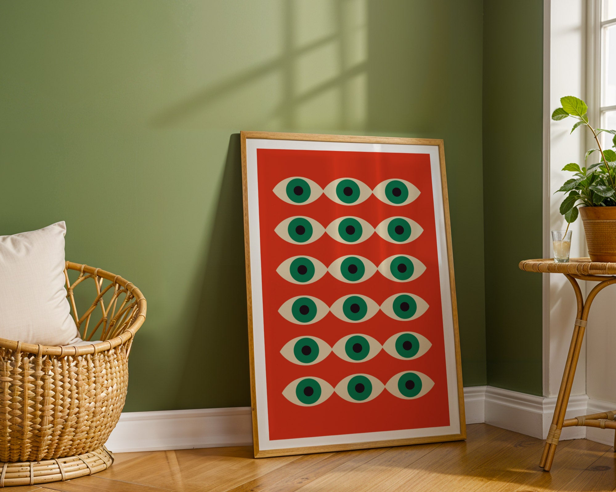 Framed artwork with geometric pattern in a room with green walls and wooden floor.