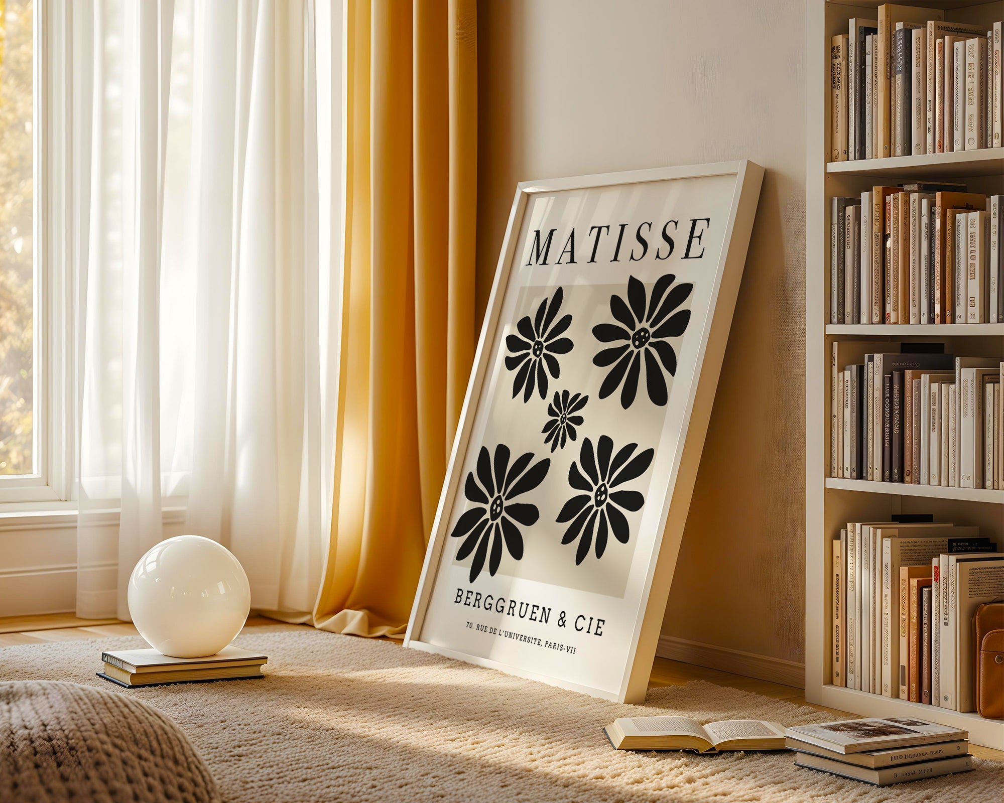 Framed artwork with floral design and text in a room with books and decor.