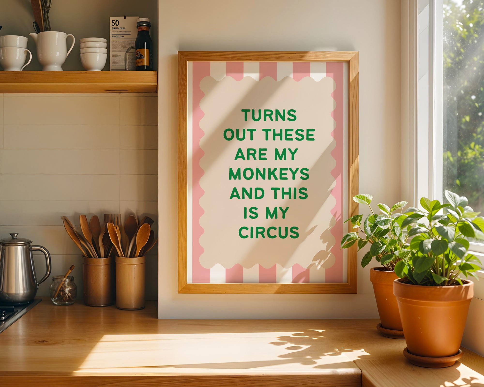 Framed print with motivational quote in a kitchen setting