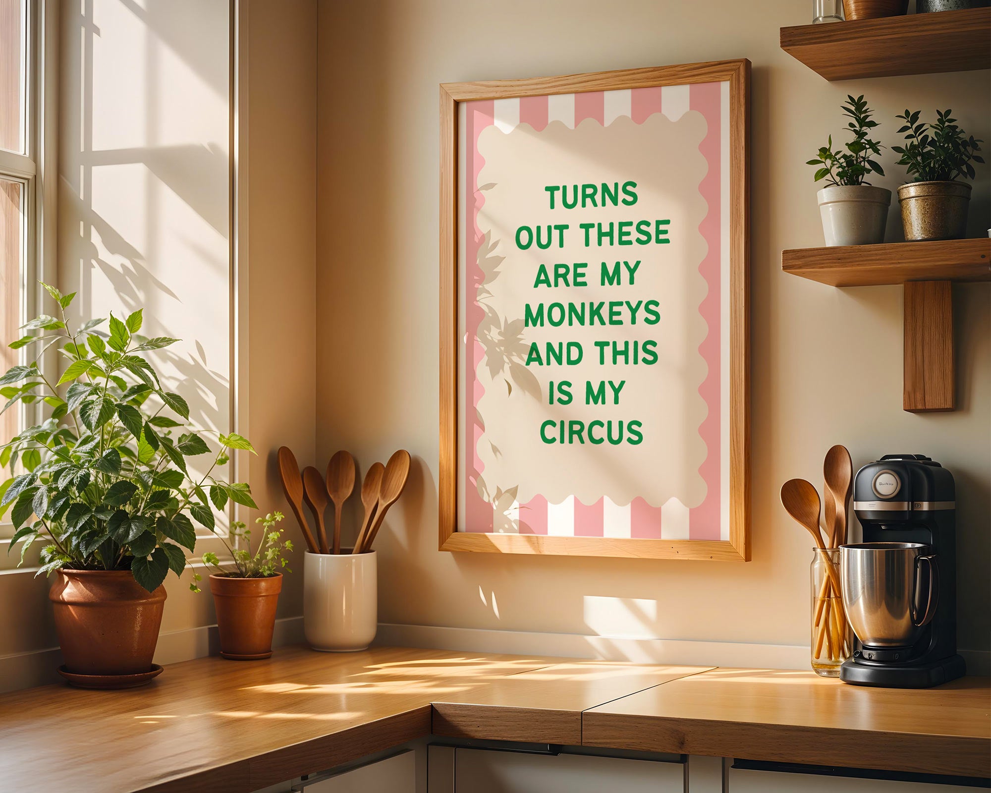 Kitchen counter with plants, utensils, and a framed quote on the wall.