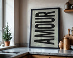 Framed artwork with the word 'AMOUR' in a kitchen setting