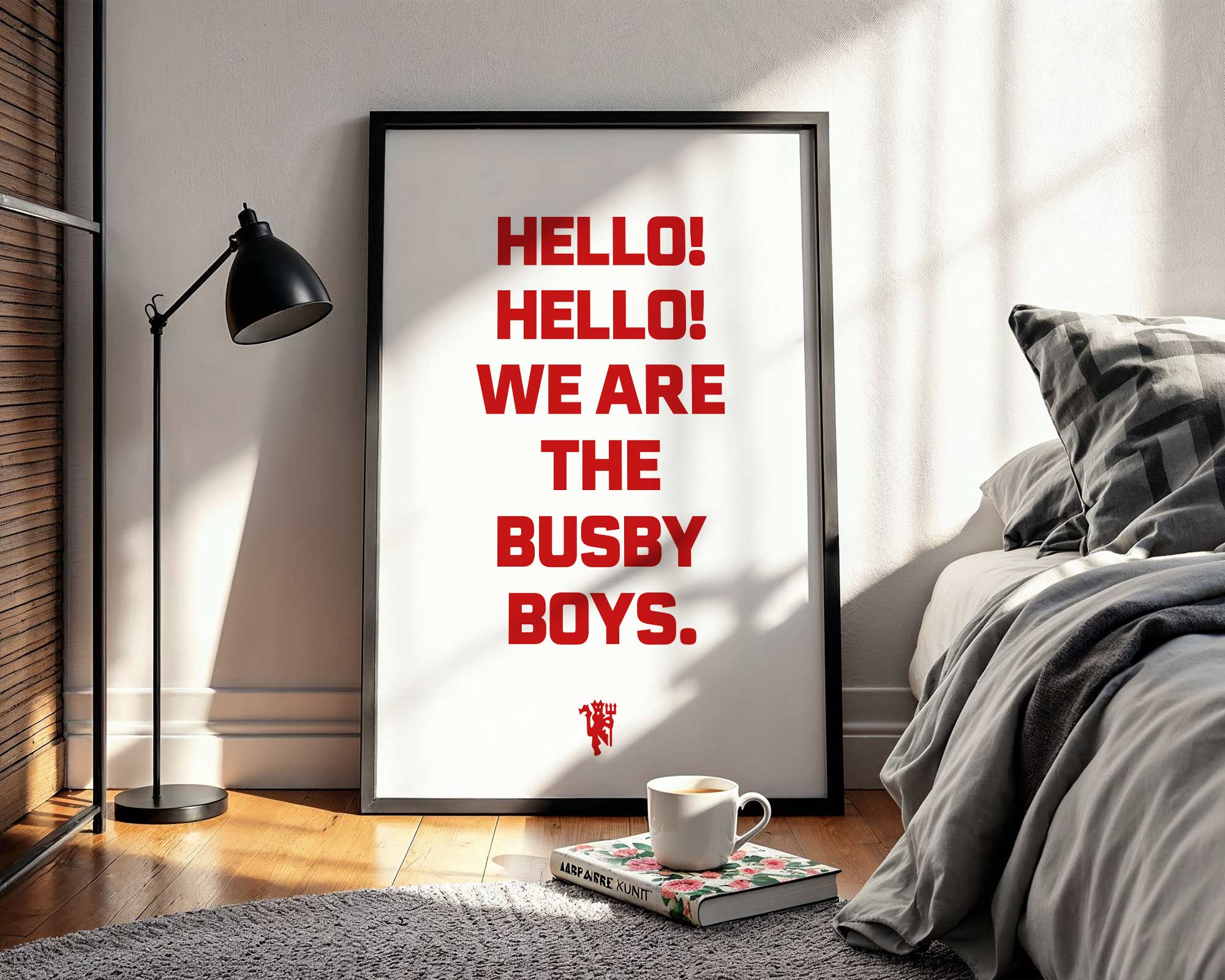 Framed poster with 'HELLO! HELLO! WE ARE THE BUSBY BOYS.' text in a bedroom setting.