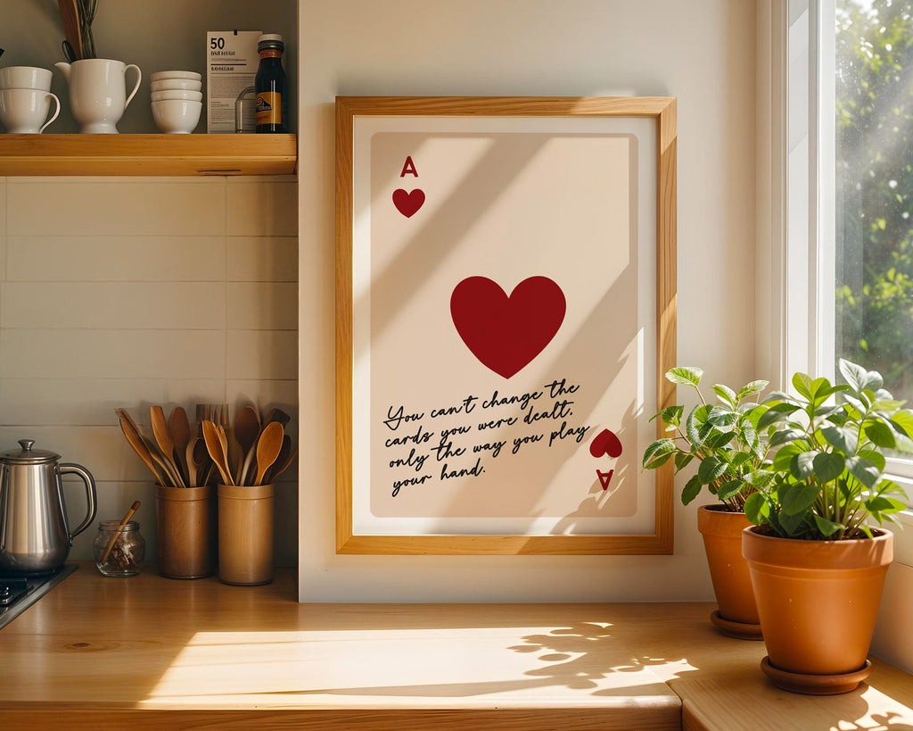 Framed artwork with a red heart and text in a kitchen setting