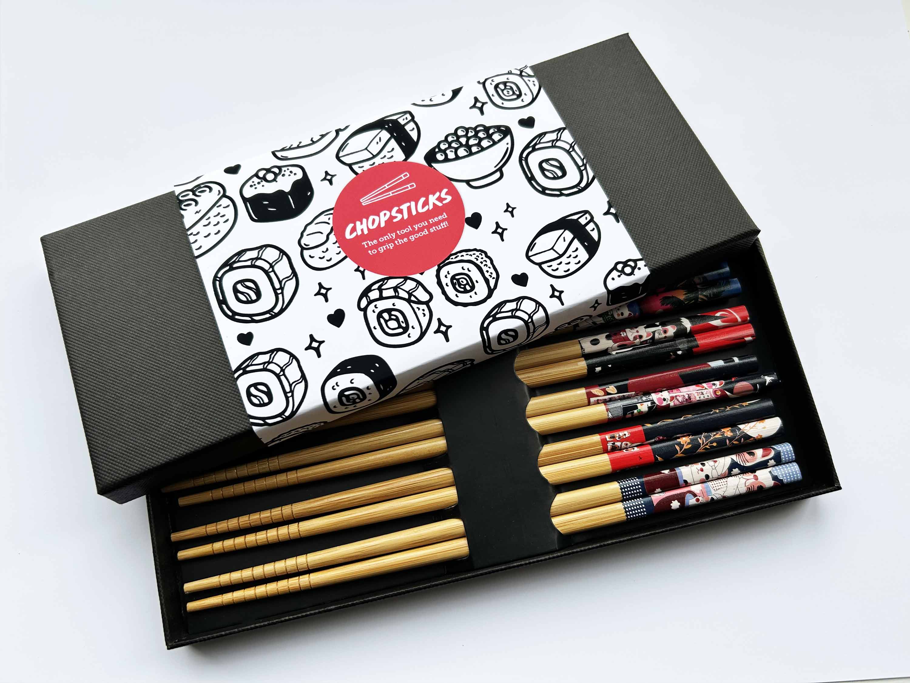Set of chopsticks in a decorative box with sushi-themed design