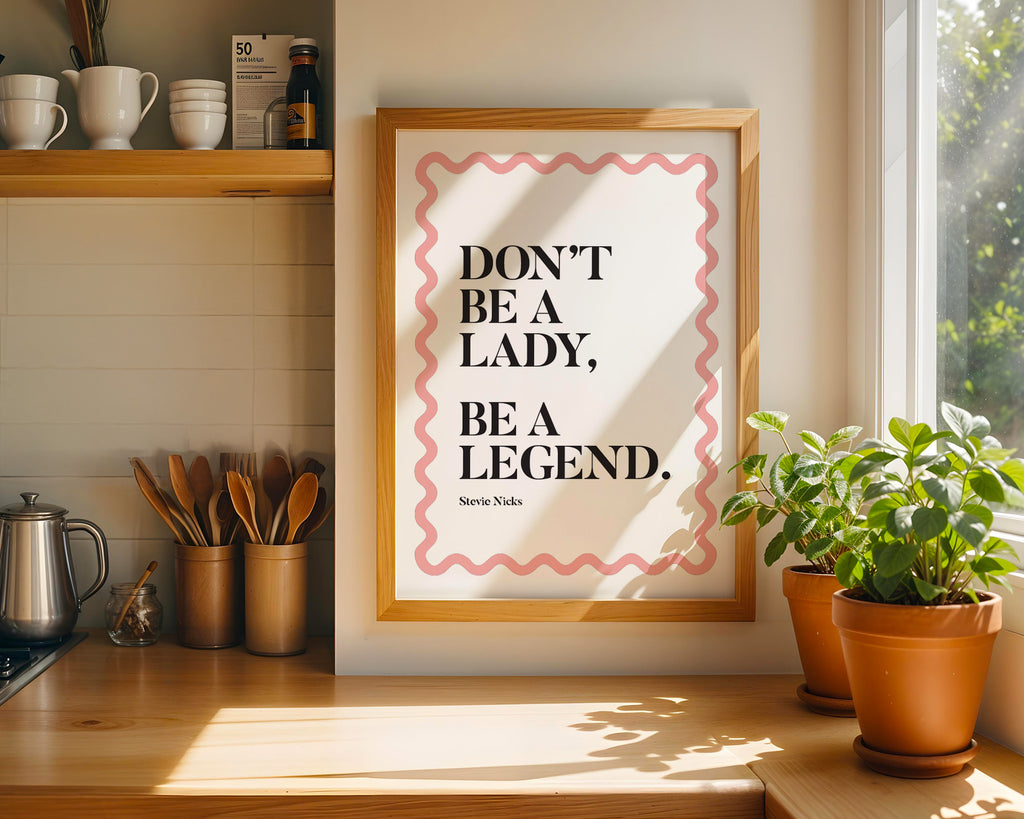 Framed print with motivational quote in a kitchen setting