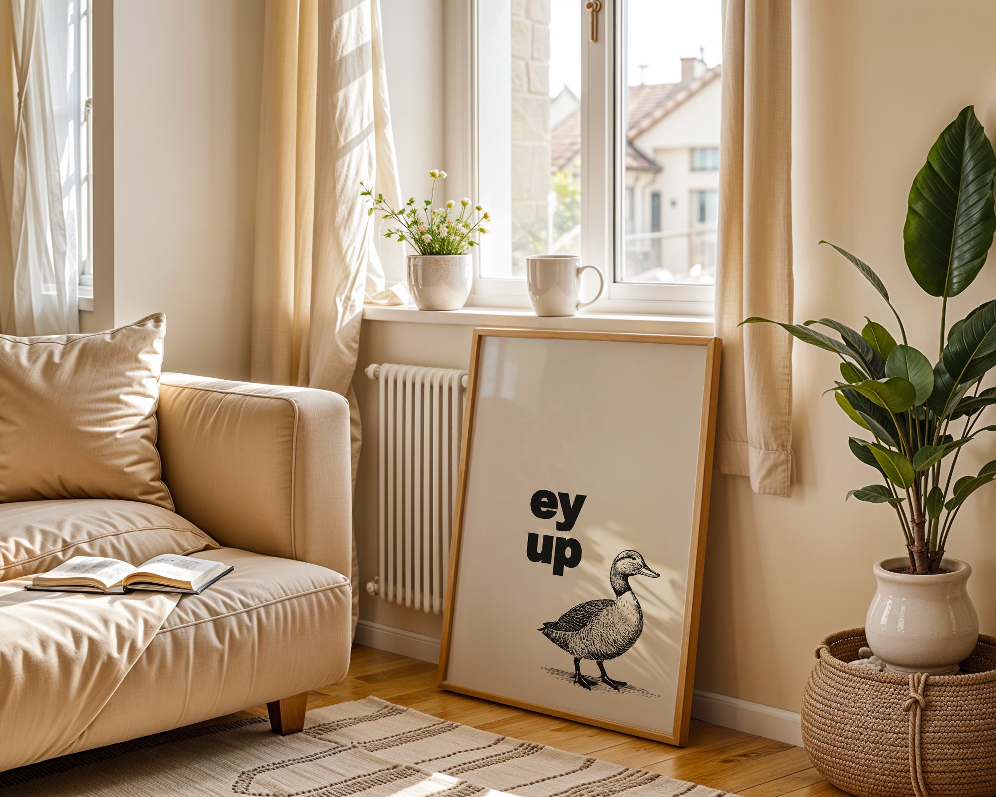 Cozy living room with a beige sofa, framed picture of a duck, and a plant.