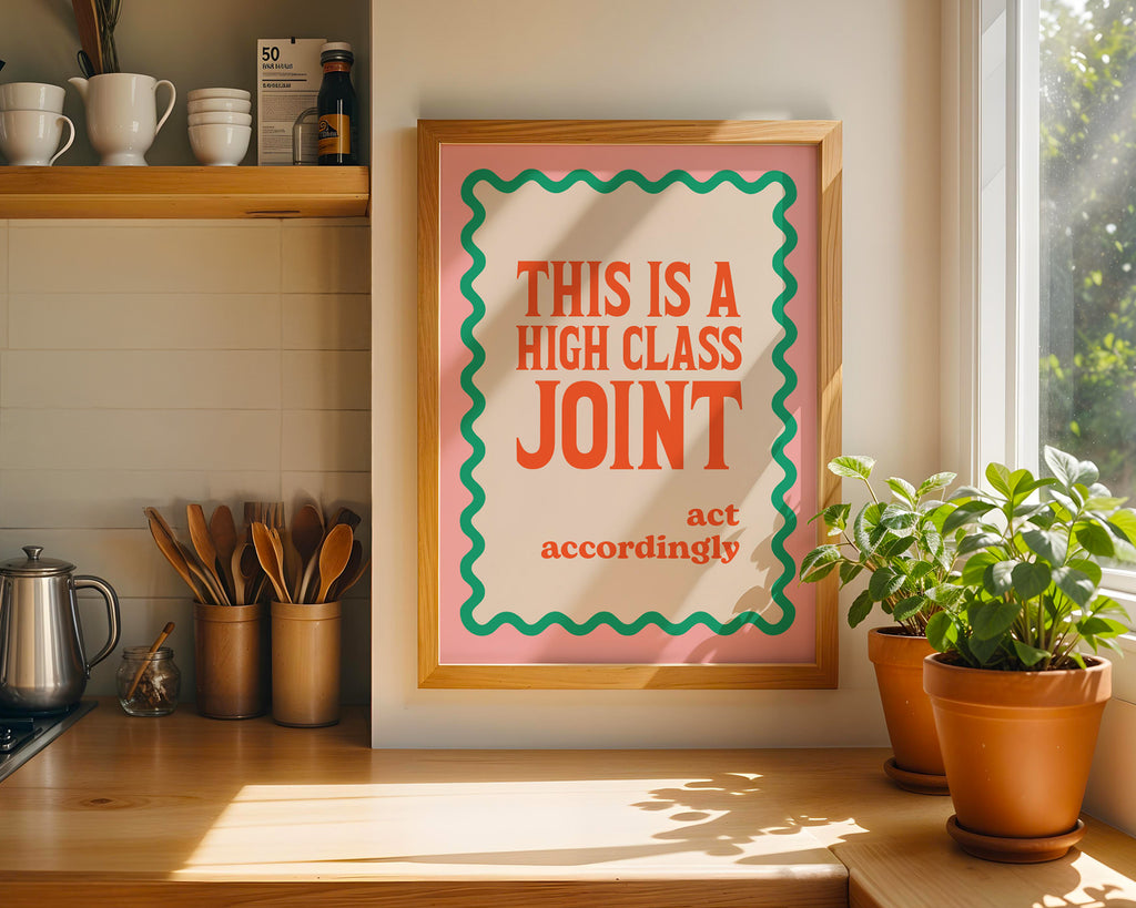 Framed poster with humorous text in a kitchen setting