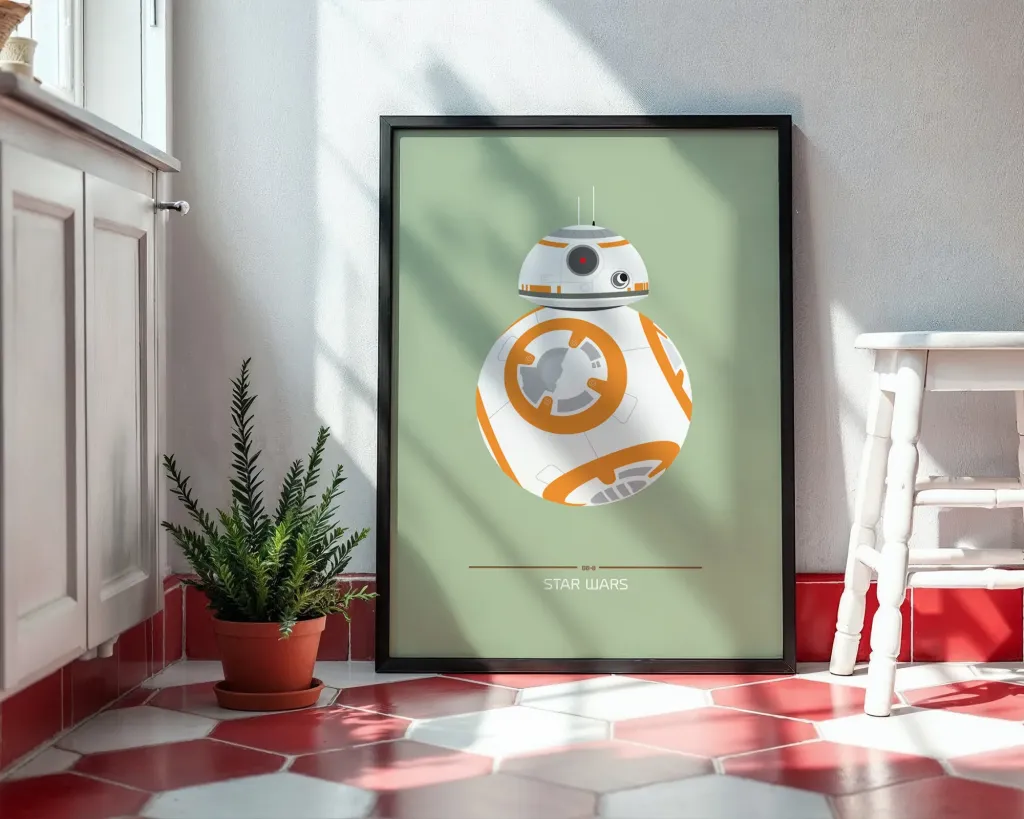 Framed poster of BB-8 from Star Wars on a wall in a room with a plant and cabinet.