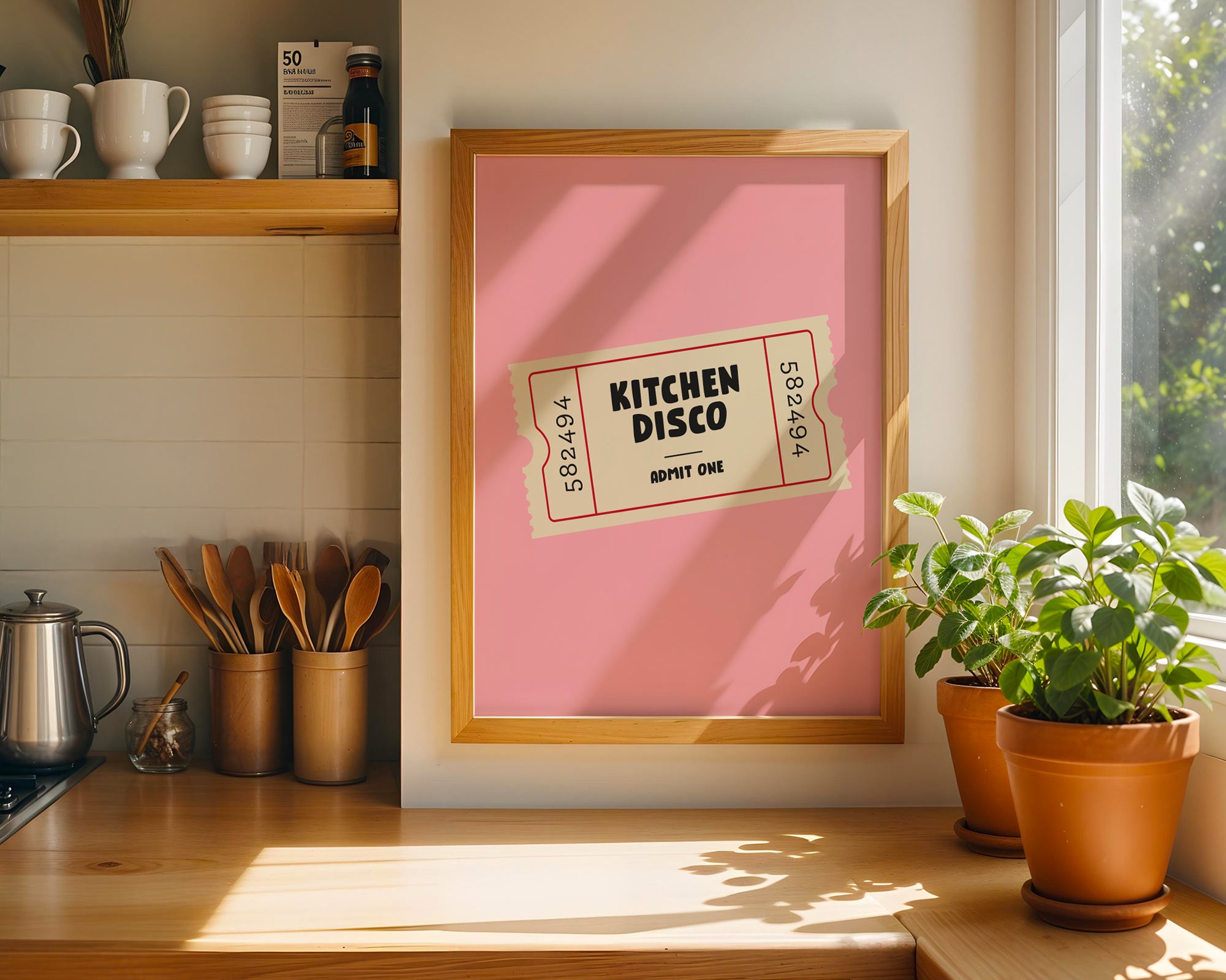 Framed poster with 'Kitchen Disco' design in a kitchen setting