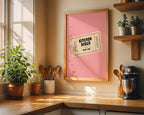 Kitchen with a framed poster titled 'Kitchen Disco' on the wall, wooden shelves with plants, and kitchen utensils.