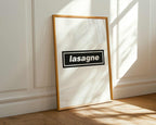 Framed picture with 'lasagne' text on a white wall