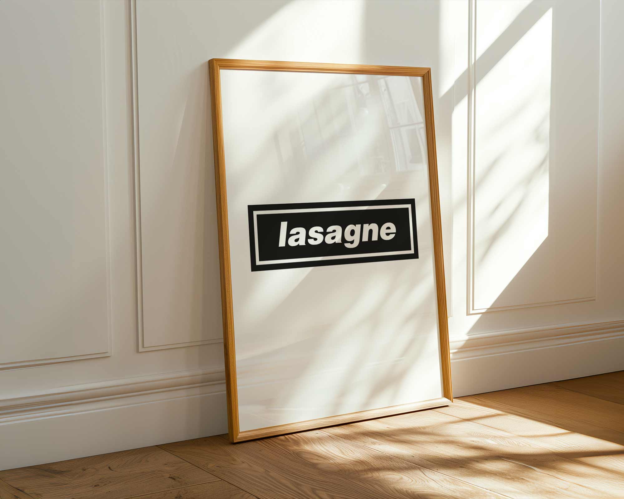 Framed picture with 'lasagne' text on a white wall