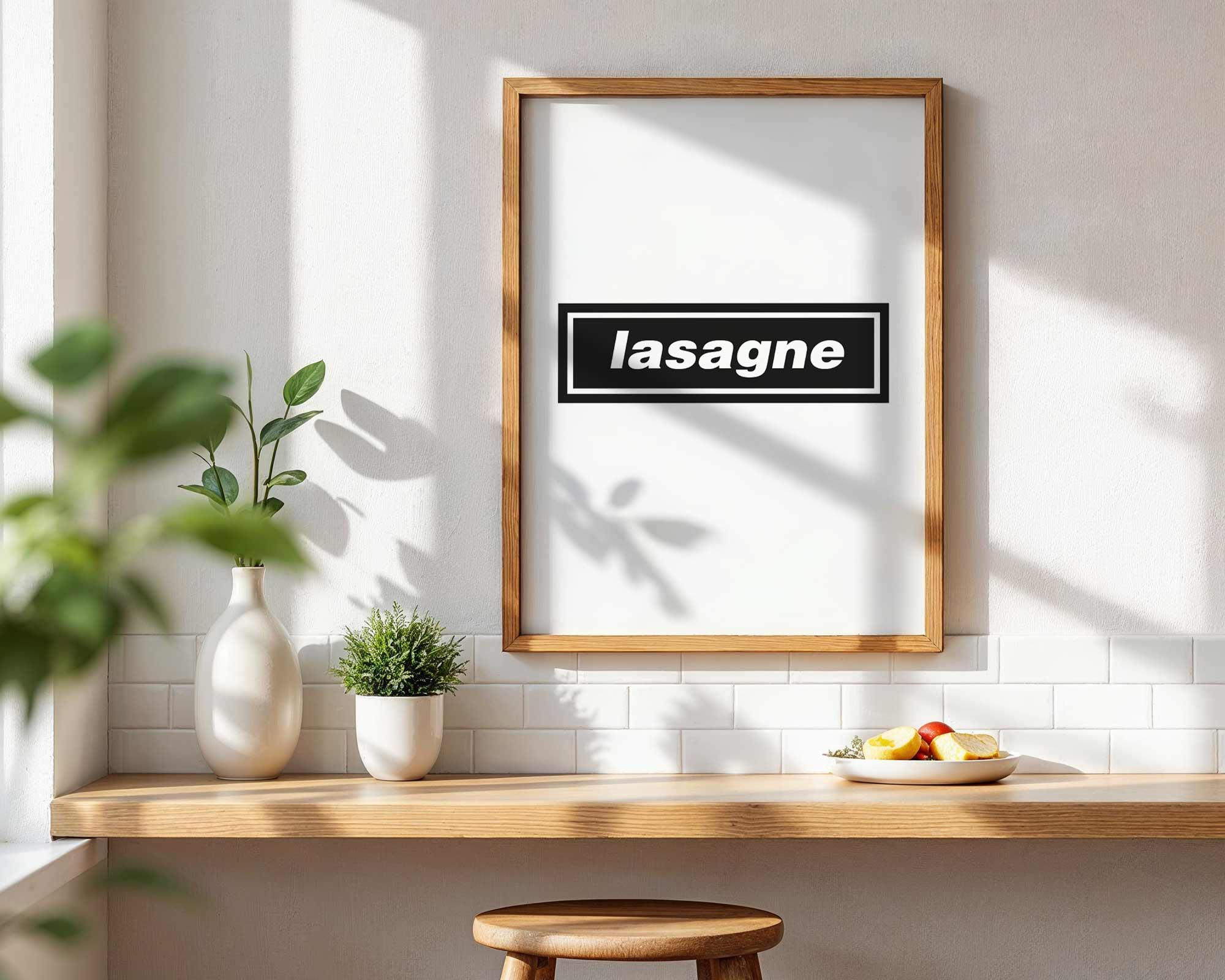 Framed picture with 'lasagne' text on a wall in a kitchen setting