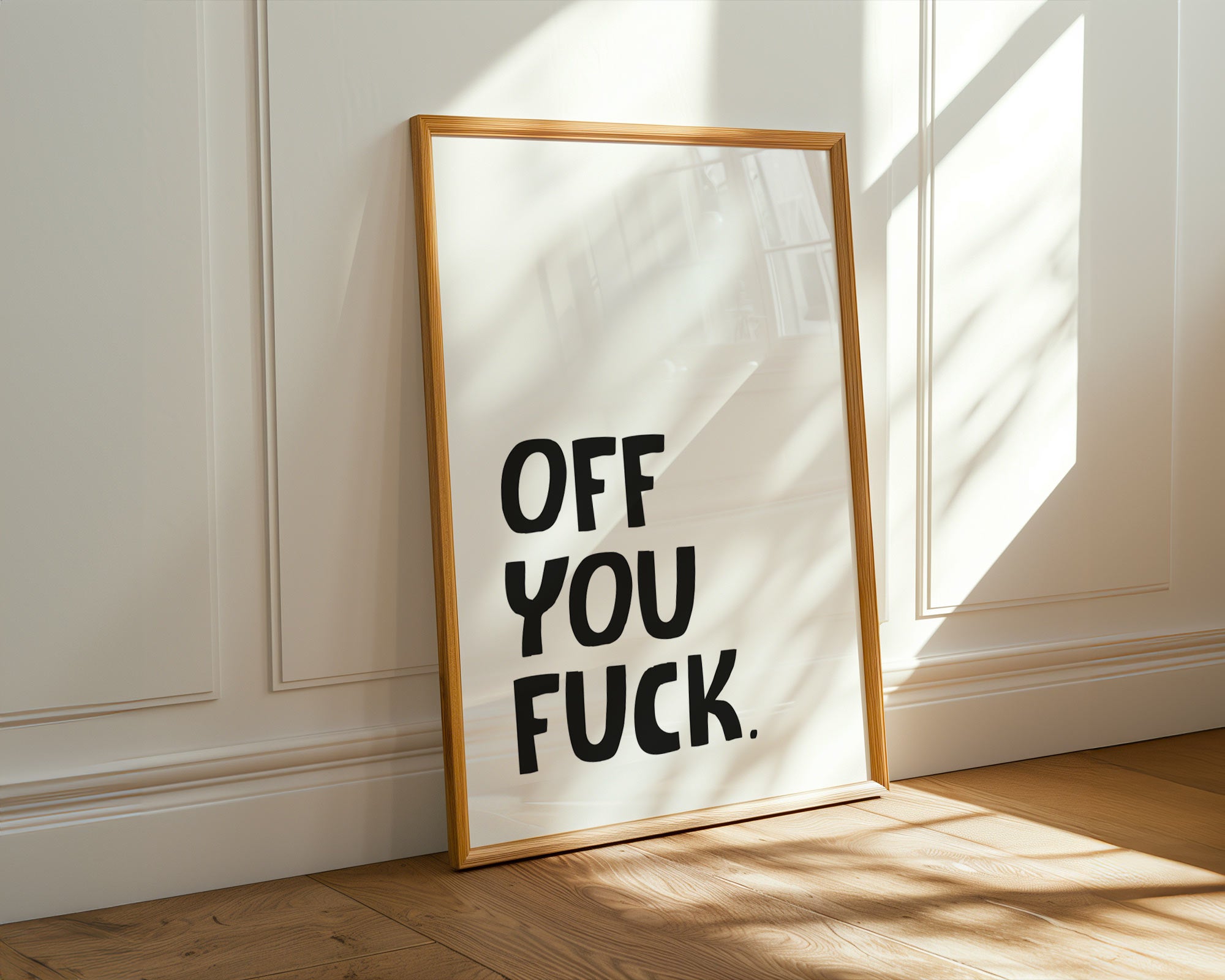 Framed artwork with text on a wall