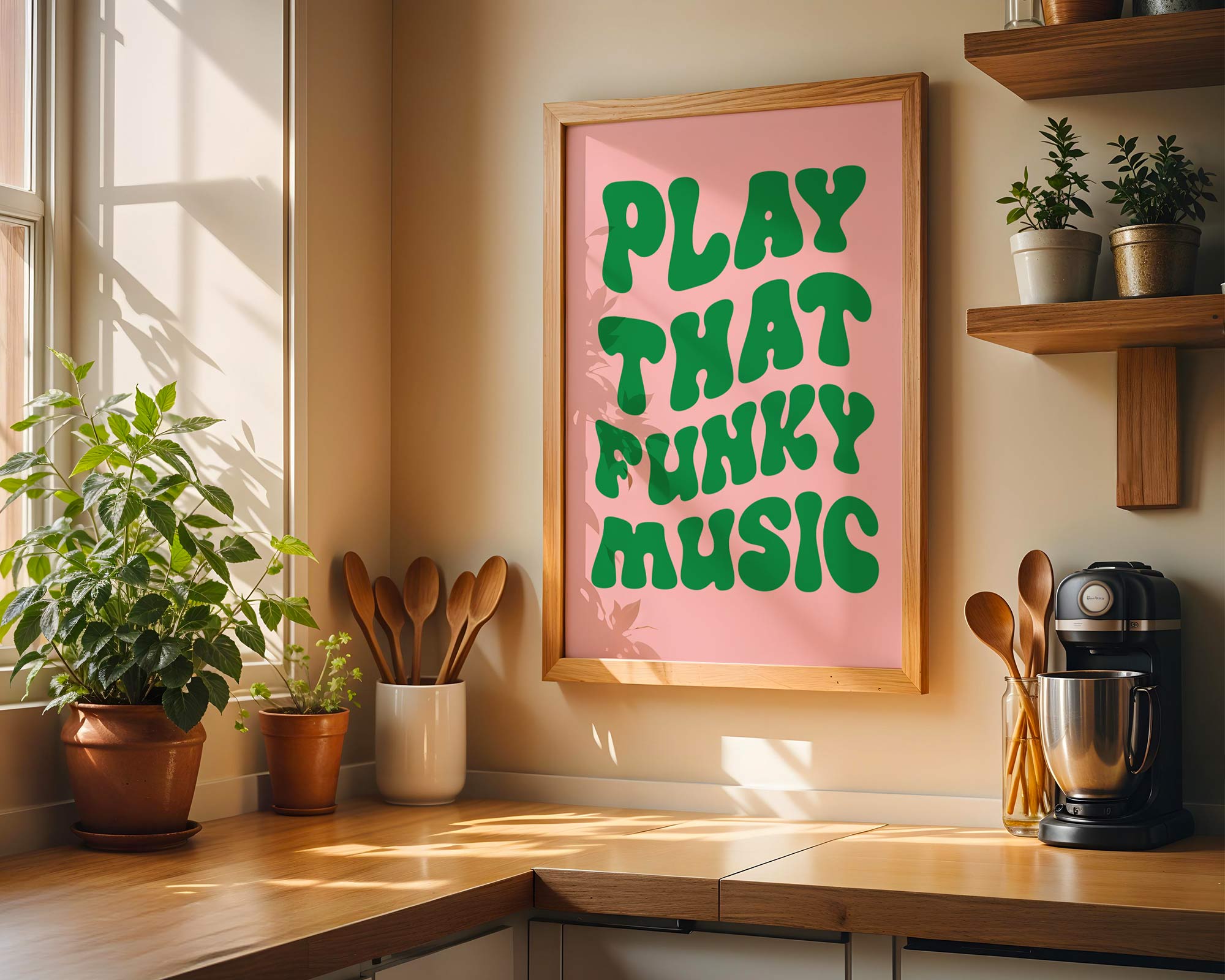 Kitchen with a pink poster reading 'Play That Funky Music' and various kitchen items.