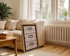 Framed 'Shower Karaoke' sign on a coffee table in a living room with a couch and plants.