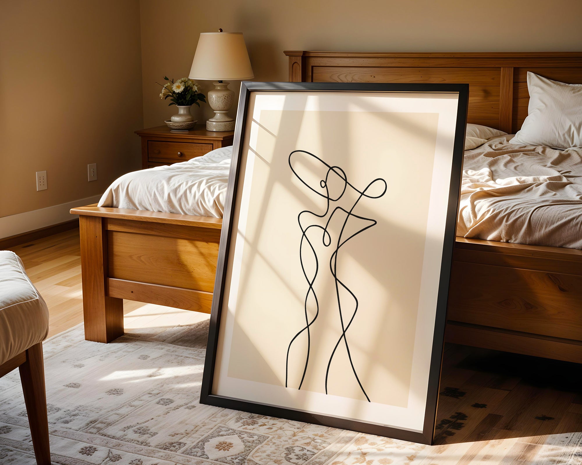 Framed abstract artwork of a woman in a bedroom setting