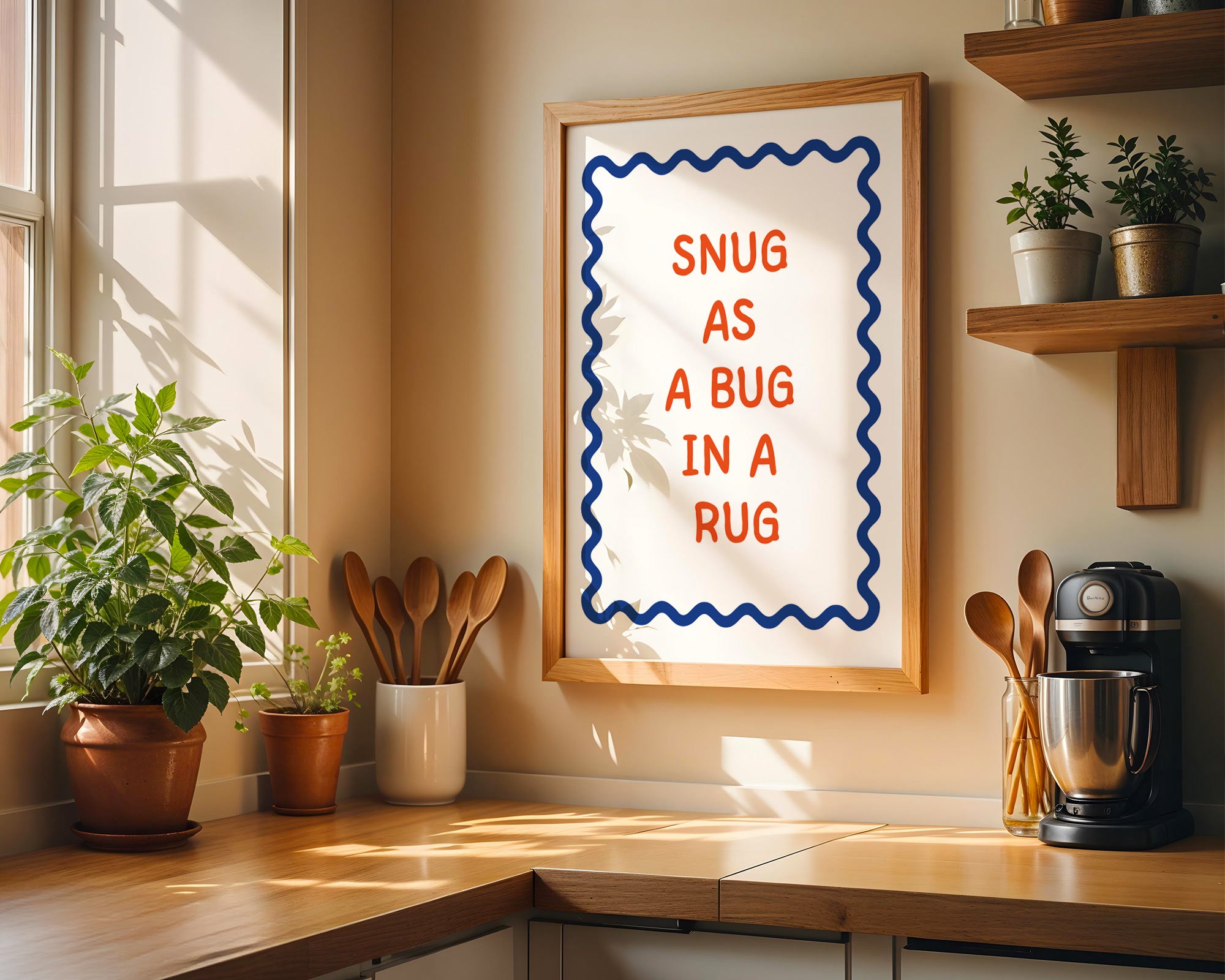 Kitchen corner with a framed quote 'Snug as a bug in a rug' on the wall.