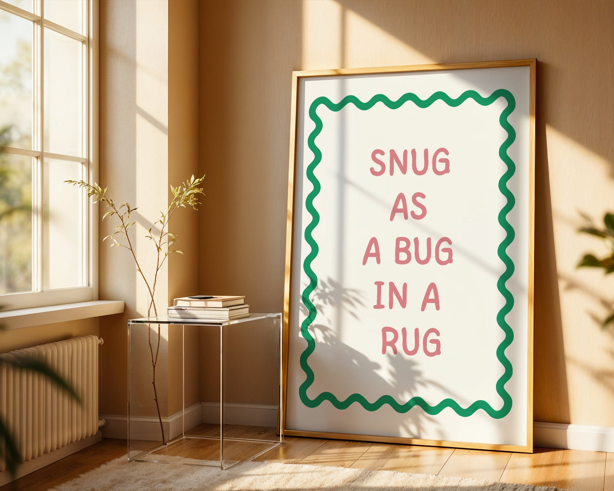 Framed print with 'Snug as a bug in a rug' text in a sunlit room.