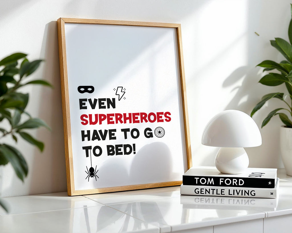 Framed poster with superhero quote on a shelf with decor items