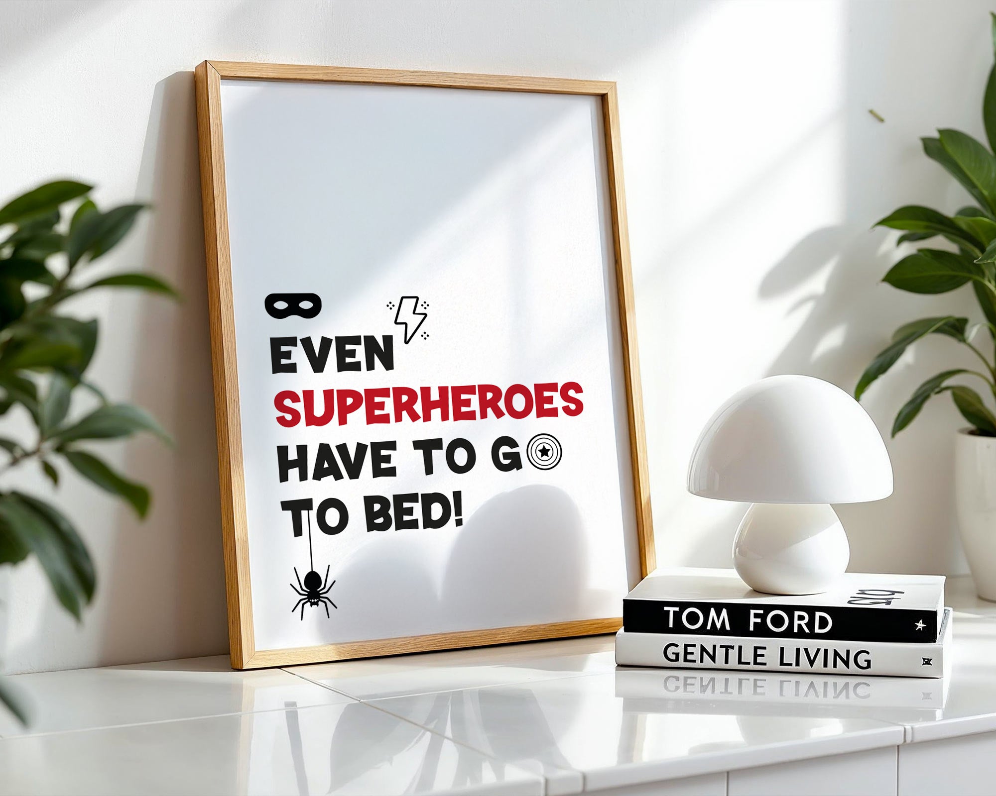 Framed poster with superhero quote on a shelf with decor items
