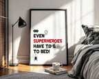 Framed poster with humorous superhero quote in a bedroom setting