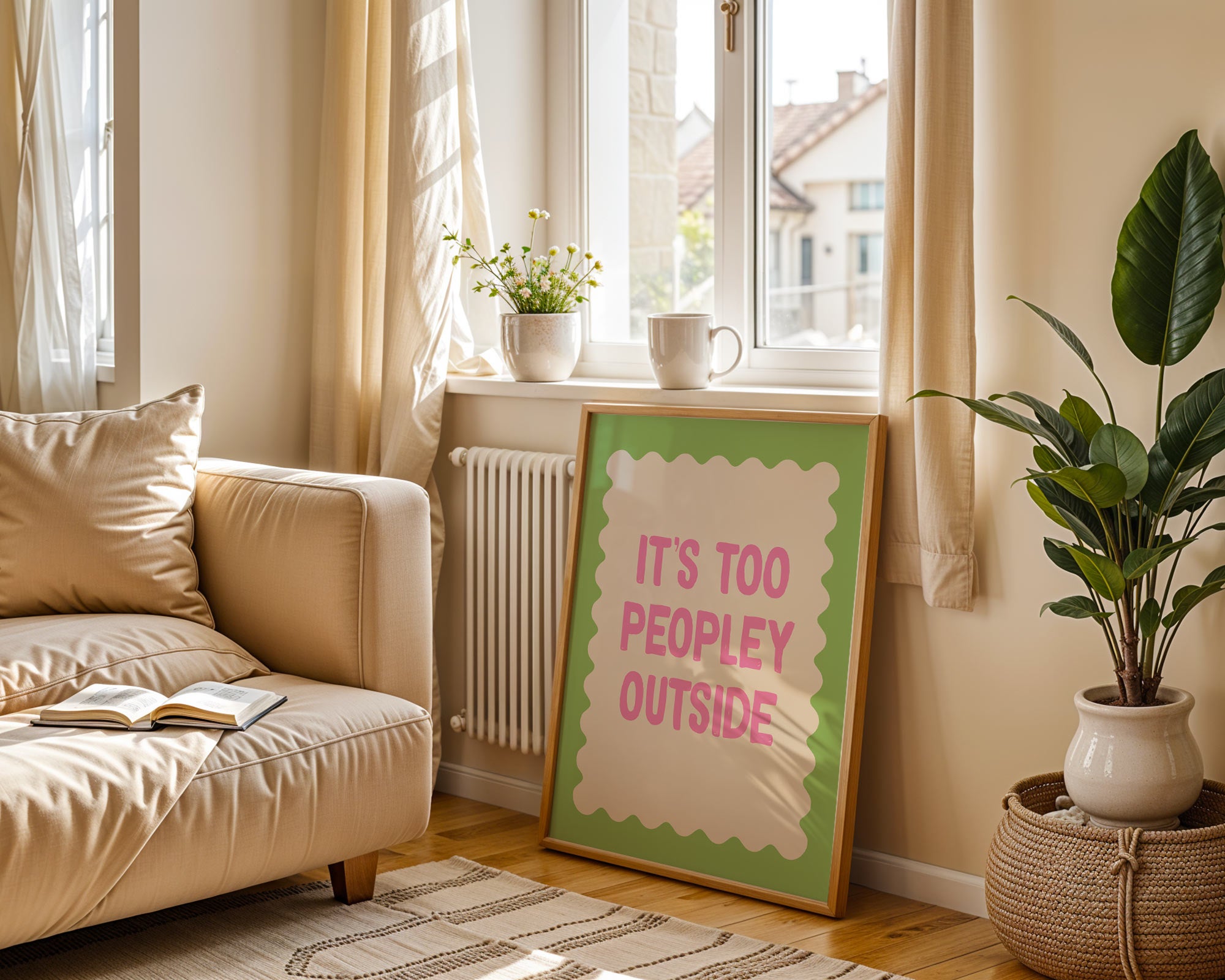 Living room with beige sofa, plant, and framed picture on a sunny day.