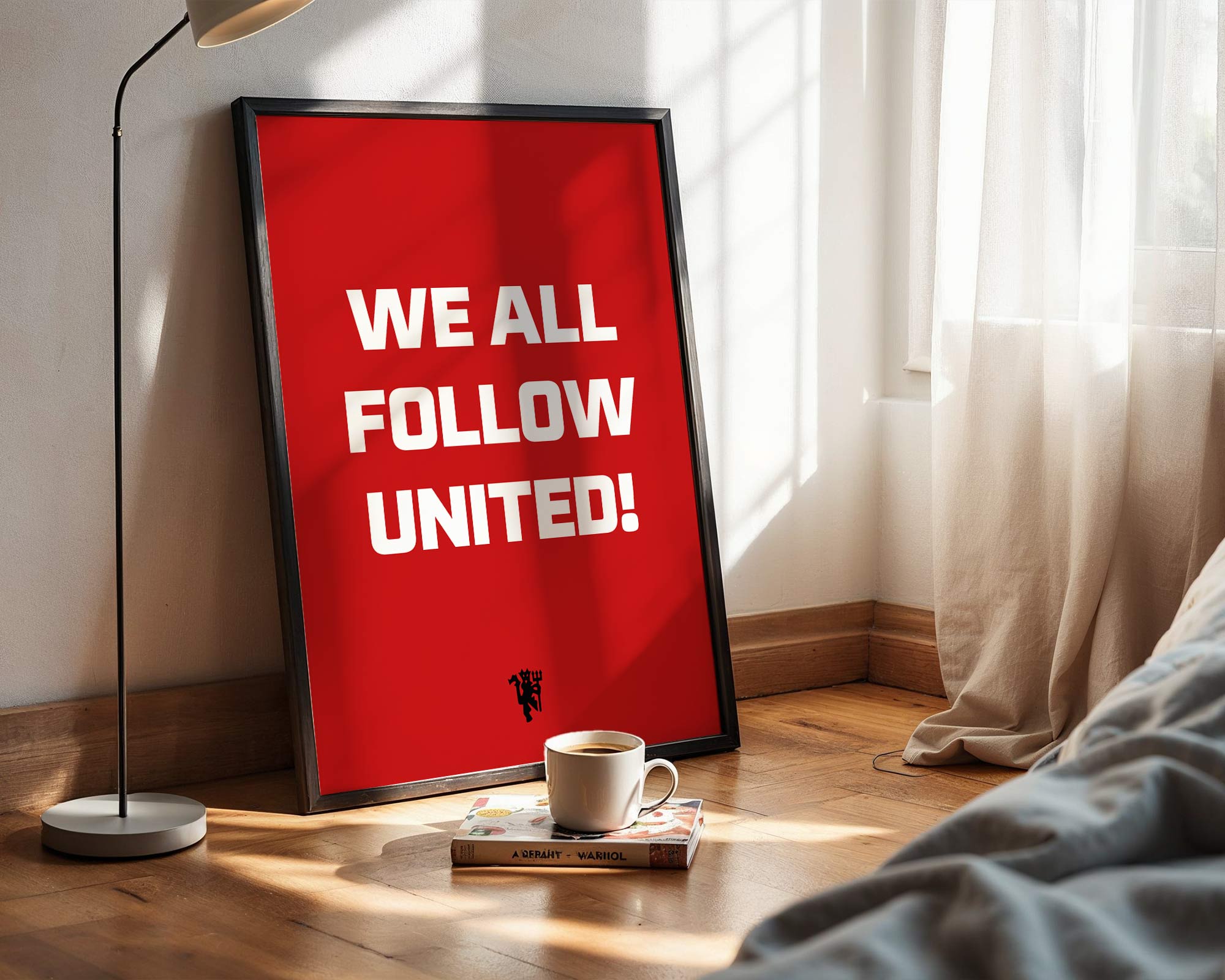 Red poster with 'WE ALL FOLLOW UNITED!' text in a room with a lamp and book.